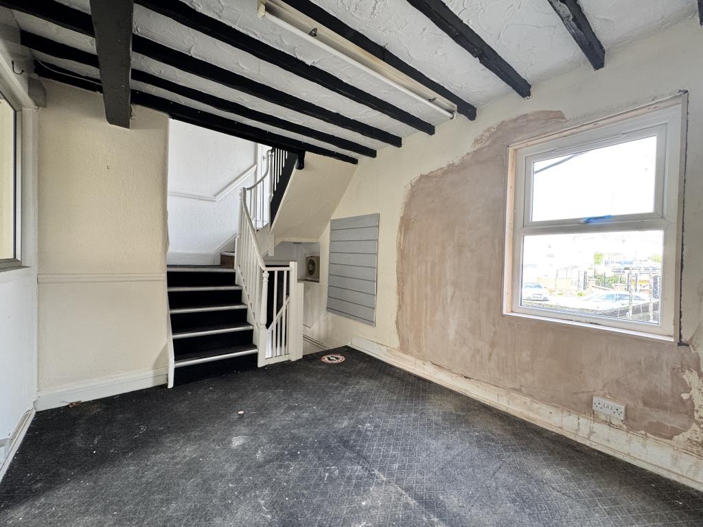 Lot: 78 - SHOP WITH OFFICE ACCOMMODATION ON UPPER FLOORS - First floor and stairs leading to the second floor